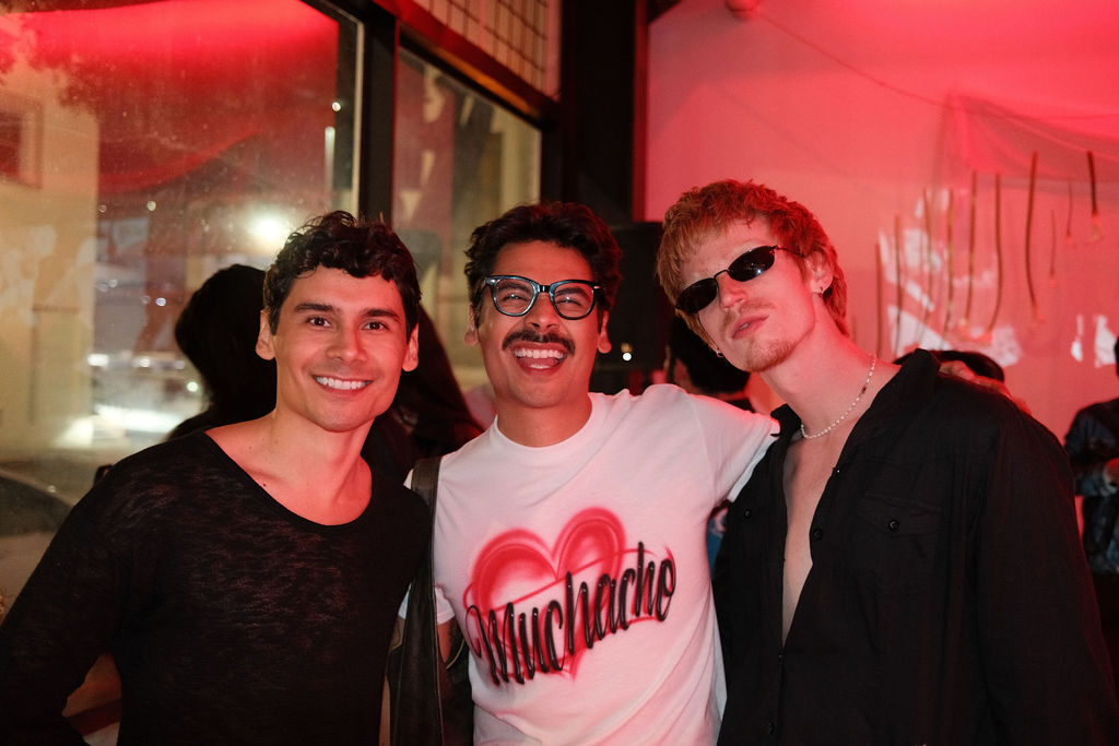 Three friends smiling at the bar