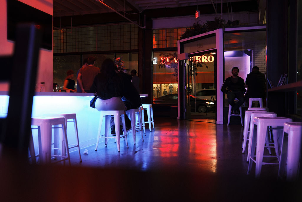 Blue-lit bar late at night