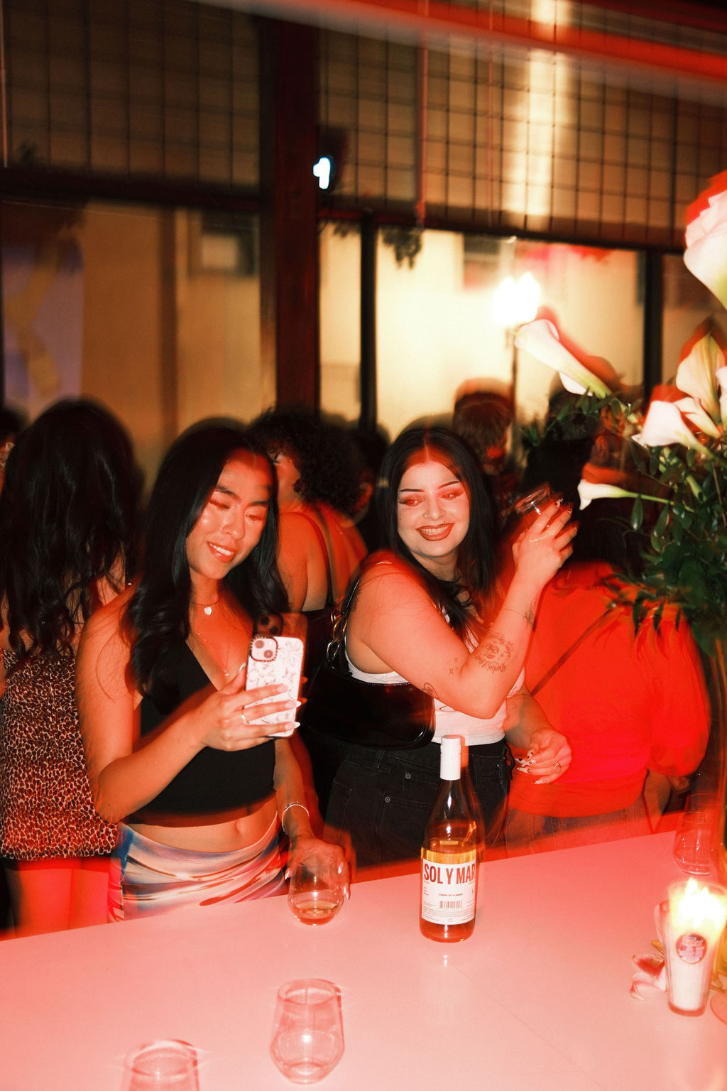 Friends at the bar with Sol y Mar